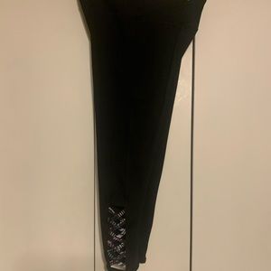 Black leggings with cute colorful crisscross design. Ankle length